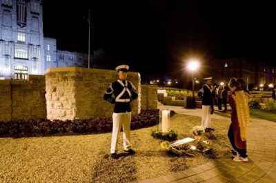 Members of the Virginia Tech Corps of Cadets stand guard as people come up to view the plaque at the April 16 Memorial.